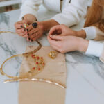 Jewelry pieces displayed on a marble table