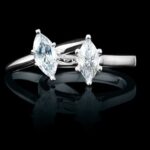 Marquise diamond rings on black background