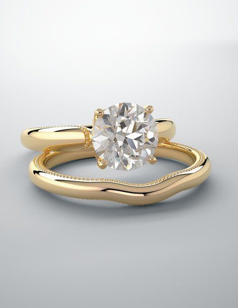 Gold diamond engagement ring with matching contoured band